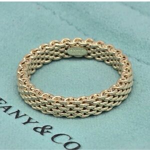 Tiffany & Co.
Rare Tiffany and Co 18 k  GOLD RING
Size 5      4mm. WORN 2 times